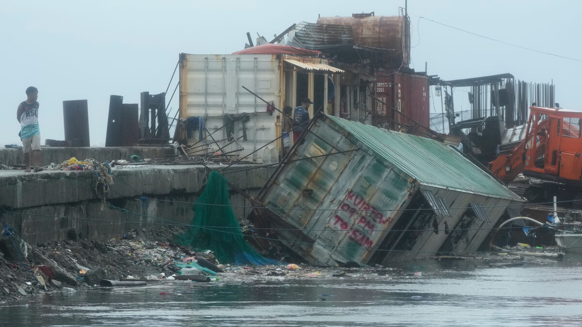 Typhoon victims are exhumed in