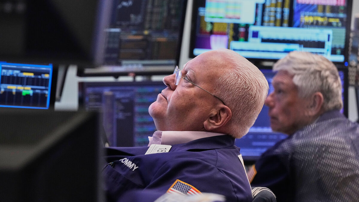 Wall Street dips amid AI fever as chip stocks slide