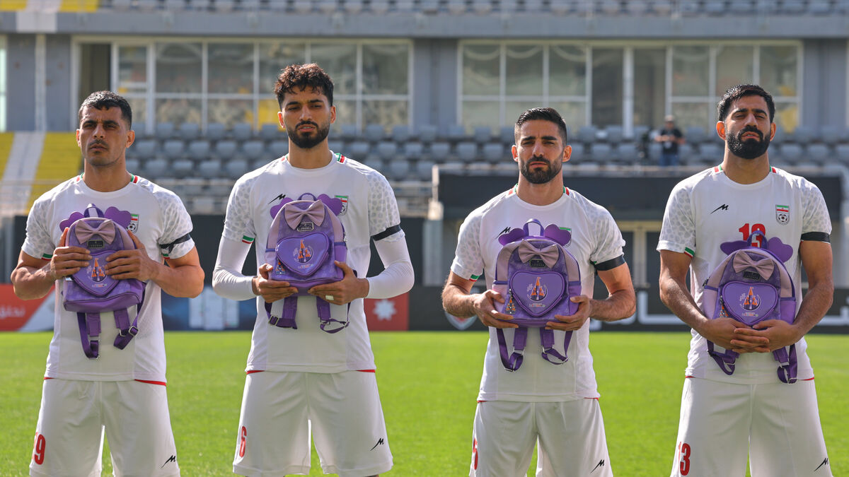 Iran players honor school attack
