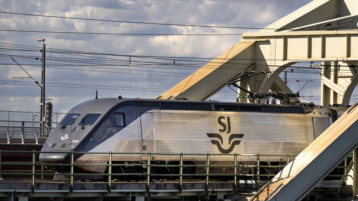 Derailed work vehicle disrupts train