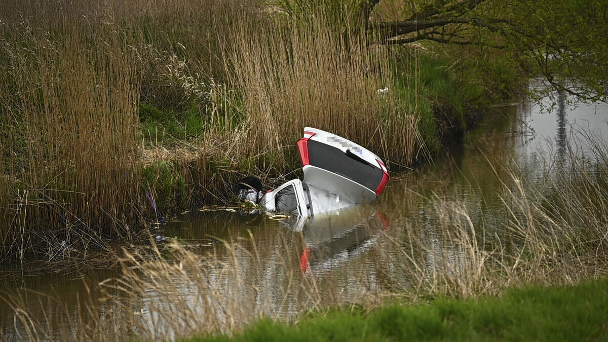 Car falls into river north