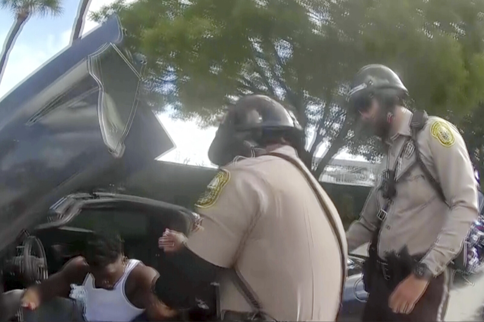 Video shows how NFL star is dragged out of car