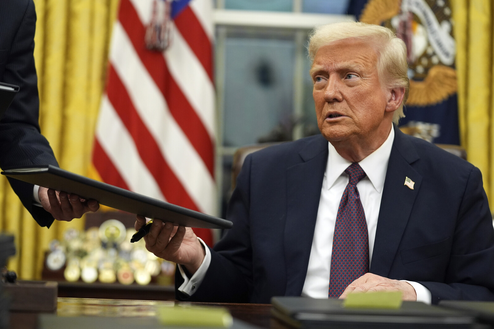 Trump stops aid for 90