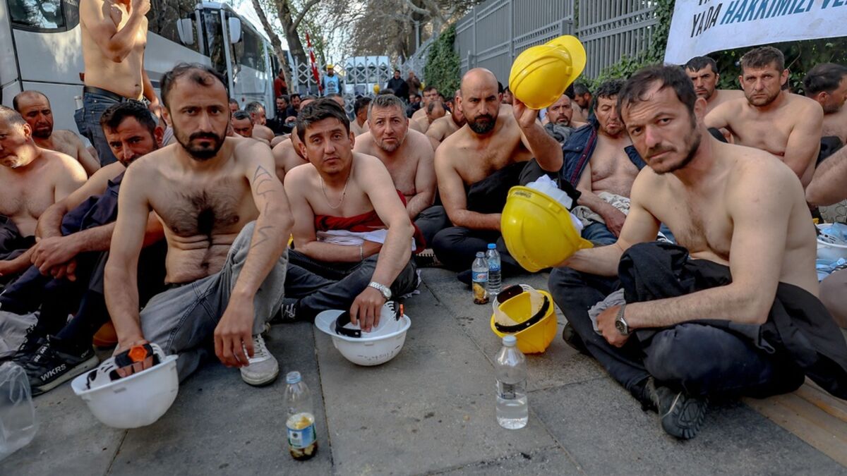Over 100 topless Turkish miners