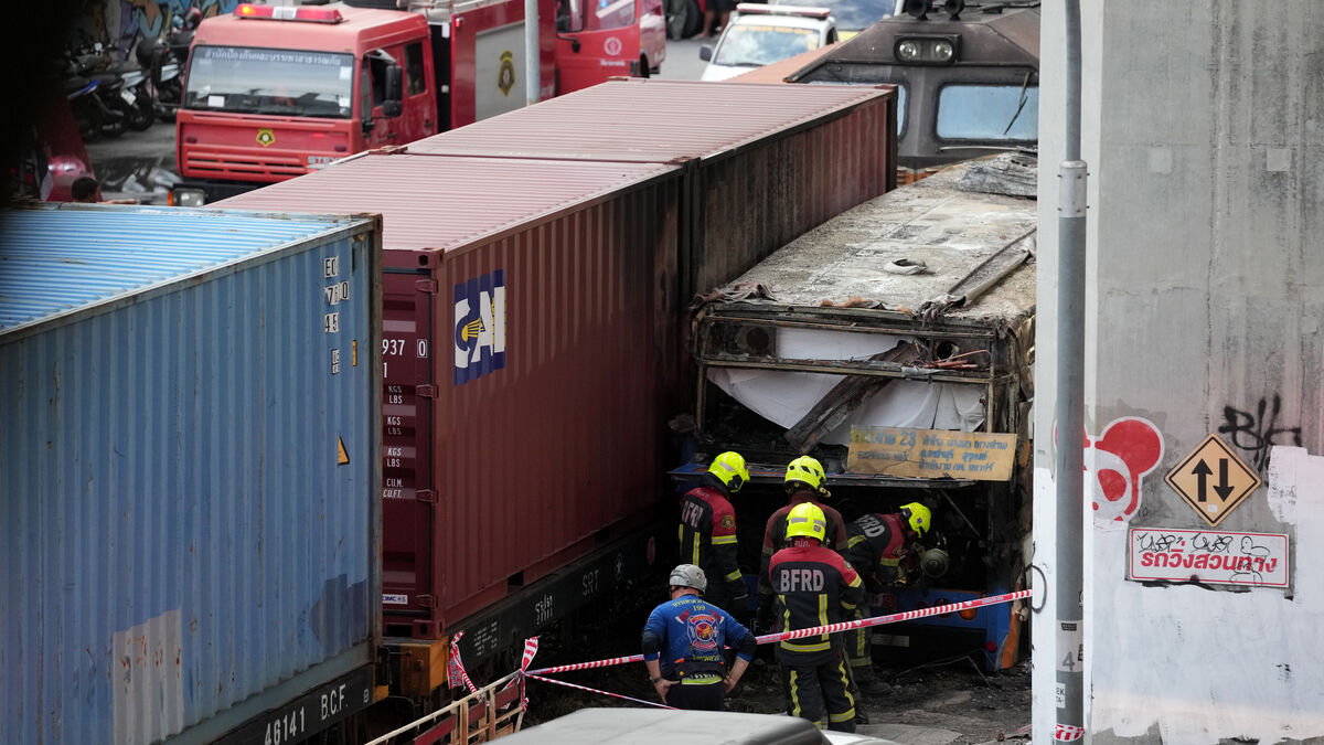 Freight train hits bus at