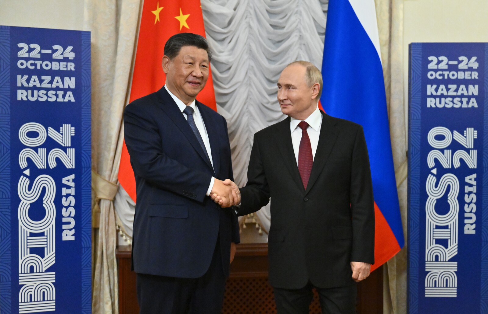 Host Putin is greeted with respect by world leaders